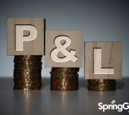 The letter P, the & sign and the letter L are sitting on top of coins. The P stands for profit and has the most amount of coins and it goes descending with the &, and the L on top of the lowest amount of coins.